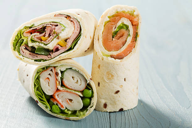 istock Mix of wraps with ham, chicken, salmon and crab served 468099822