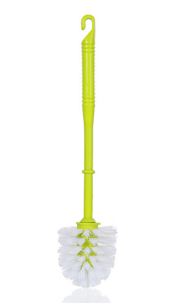 A green and white plastic toilet brush Plastic green toilet brush isolated on white background toilet brush photos stock pictures, royalty-free photos & images