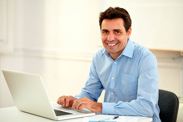 istock Handsome latin businessman smiling at you 468102223