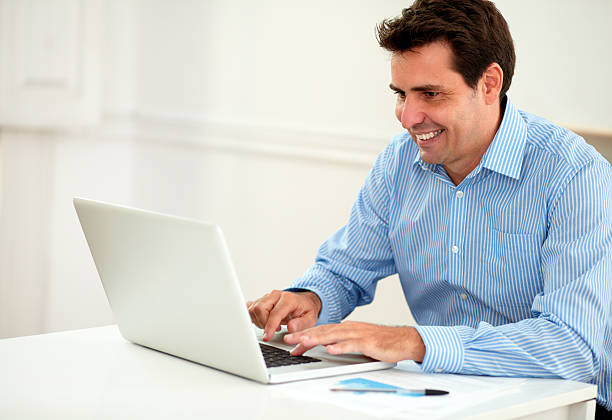 istock Attractive male entrepreneur working on his laptop 468102231