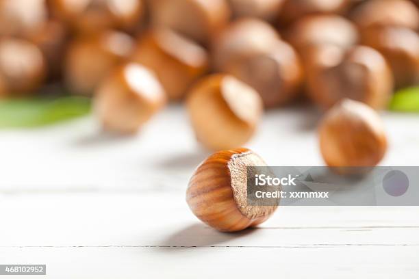 Hazelnut On White Table Stock Photo - Download Image Now - 2015, Autumn, Brown