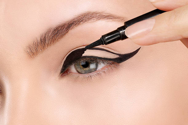 istock Beautiful model applying foundation with a brush 468104266