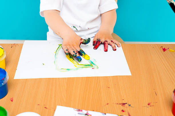 istock Little boy painting 468107222