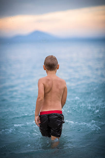 istock Young boy enjoys sea 468108550