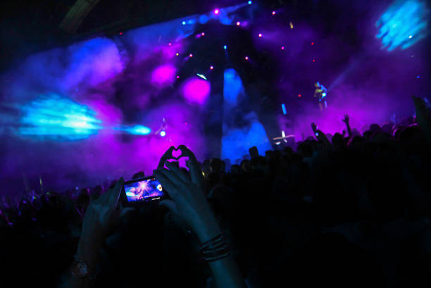 istock smartphone filming live music event 468109715