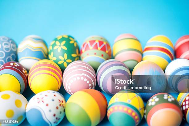 Closeup Of On Decorated Easter Eggs Against Blue Background Stock Photo - Download Image Now