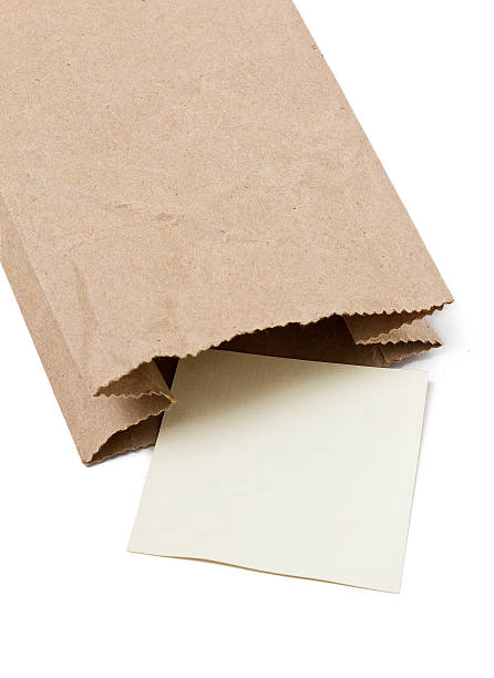 istock Note in Brown paper bag on a White Background 468113553