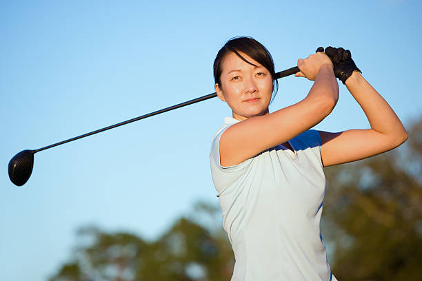 istock Asian woman golf swing 468115218
