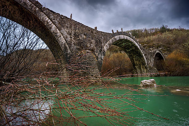 istock Triple old stone bridge in Zagorohoria, winter time 468115710