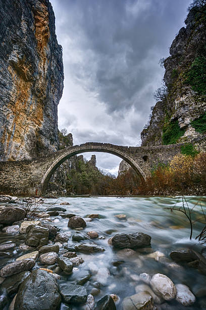 Old stone bridge in Zagorohoria Old stone bridge in Zagorohoria, winter time. zagori stock pictures, royalty-free photos & images