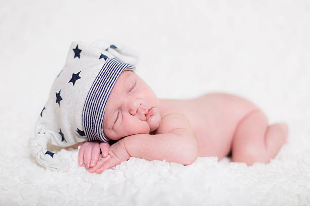 istock Gorgeous peacefully sleeping Caucasian newborn on white blanket 468117150