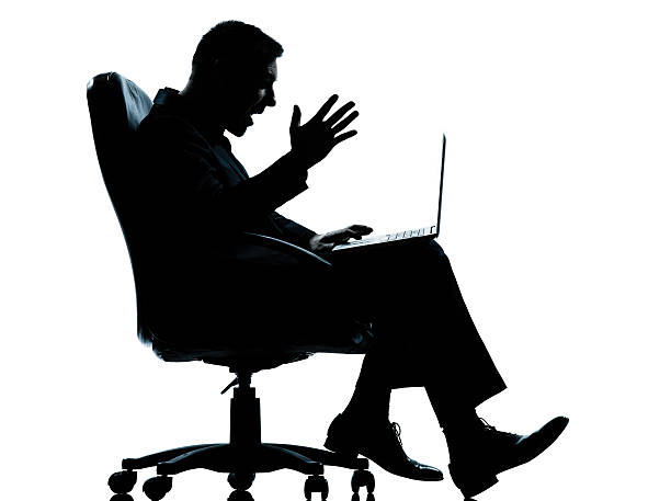 istock one business man computer computing sitting in armchair silhouet 468125062