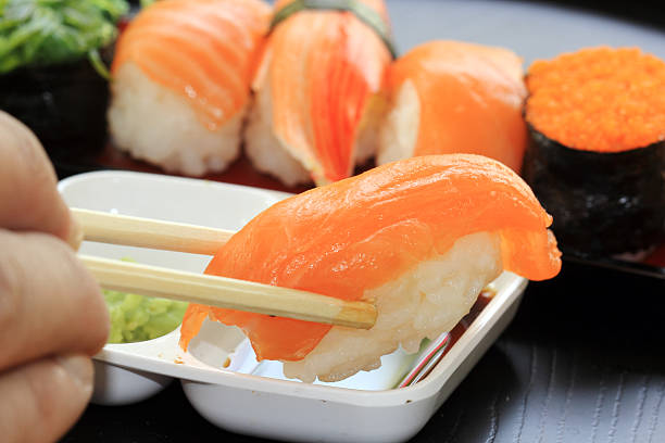 istock chopsticks with japanese sushi 468131533