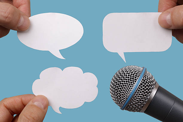Blank speech bubbles with microphone Conference, interview or social media concept with microphone and blank speech bubbles tv reporter photos stock pictures, royalty-free photos & images