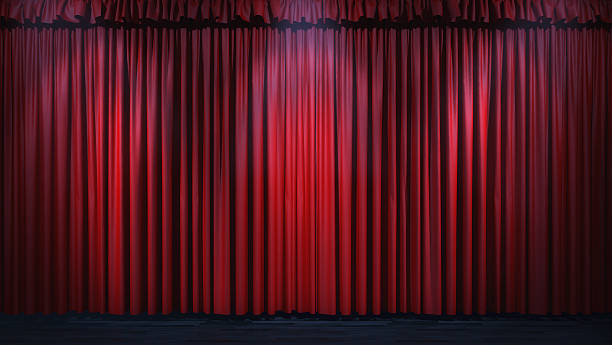 istock 3d red curtain lit by spot lights 468133396
