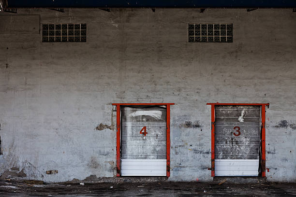 istock Old Grungy Industrial Garage Door with Graffitis. 468134183
