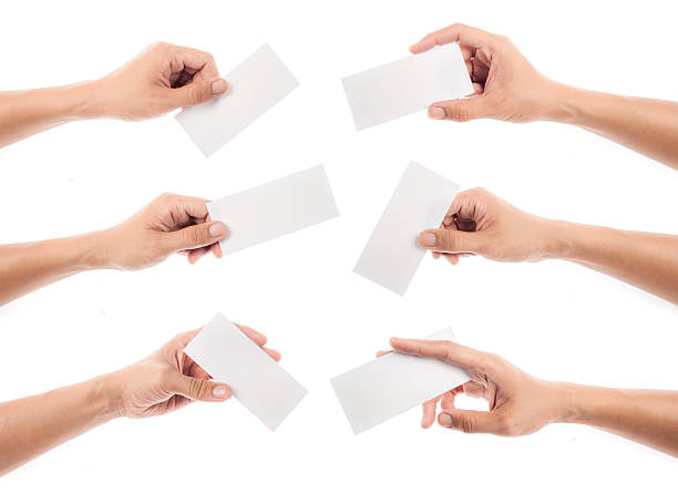 raccolta della mano che tiene la carta isolato su sfondo bianco - greeting card cards blank greeting foto e immagini stock