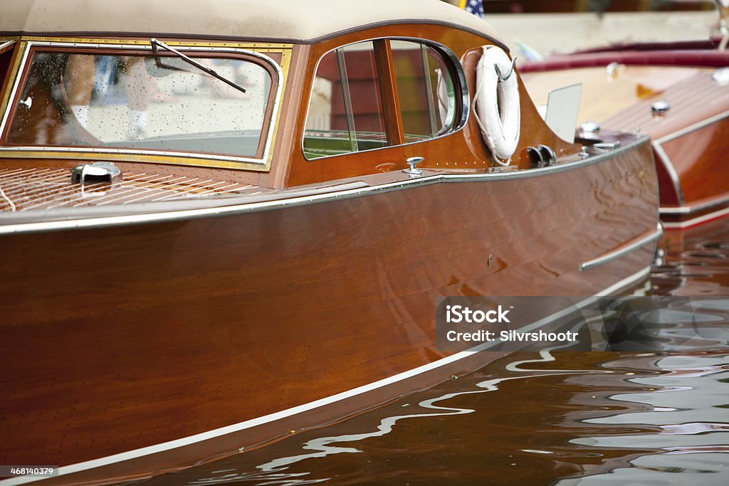 Wooden boat show in Sandpoint Idaho A beautifully restored Chris Craft powerboat is moored at a dock during a Wooden Boat Show in Sandpoint, Idaho. Nautical Vessel Stock Photo