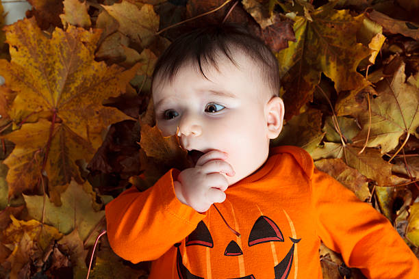 istock baby girl on leaf 468143390