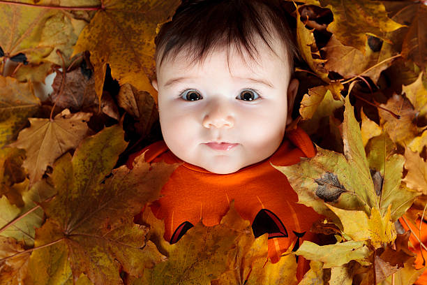 istock baby girl on leaf 468143394