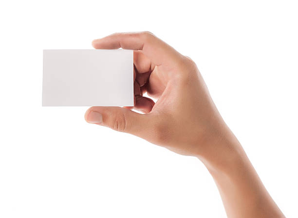istock Hands hold business cards on white background 468143574