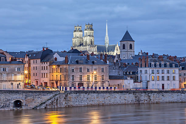 Embankment of Loire and Orleans Cathedral Embankment of Loire river and Orleans Cathedral in the evening, Orleans, France loire valley photos stock pictures, royalty-free photos & images
