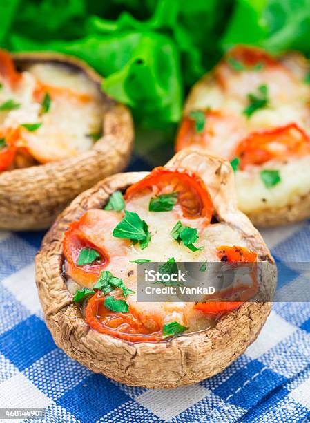 Mushrooms Stuffed With Mozzarella And Tomato Stock Photo - Download Image Now - Cheese, Cherry Tomato, Edible Mushroom