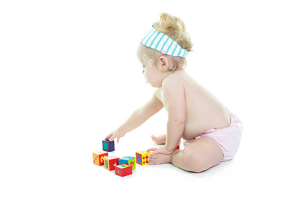 istock Blond baby Play block in studio 468144964