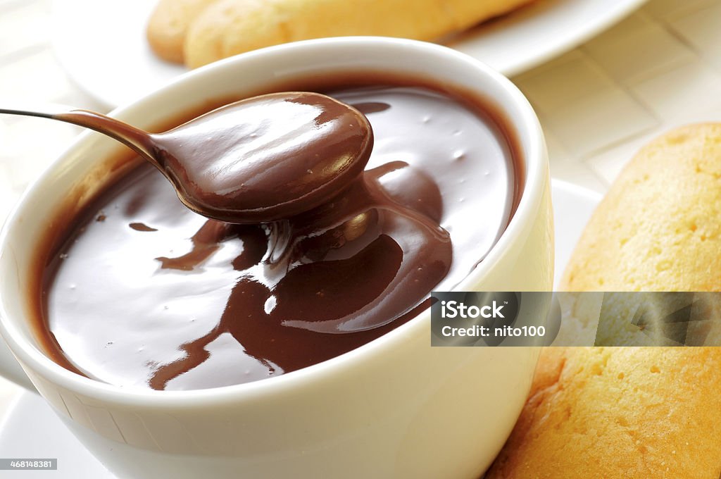 hot chocolate with typical pastries of Catalonia, Spain closeup of a cup of xocolata i melindros, hot chocolate with typical pastries of Catalonia, Spain Baked Pastry Item Stock Photo