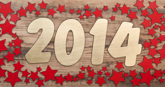 stars background and golden number 2014 on a old wooden background. Happy New Year