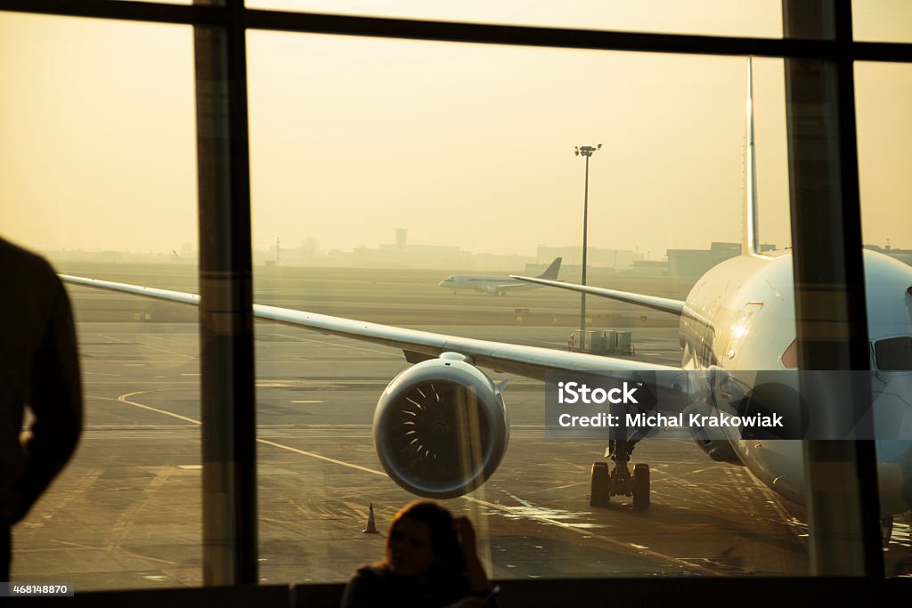 Passenger airplanes seen through window of the airport in Warsaw View through airport window. Airport Stock Photo