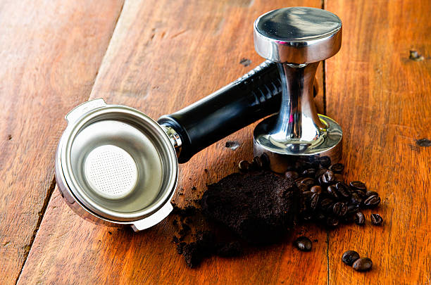 istock coffee filter holder and tamper on wood table 468149924