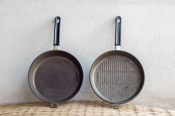 istock old iron pan still life on concrete wall 468151280