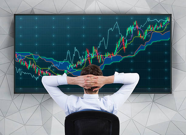 istock businessman looking on charts 468153670