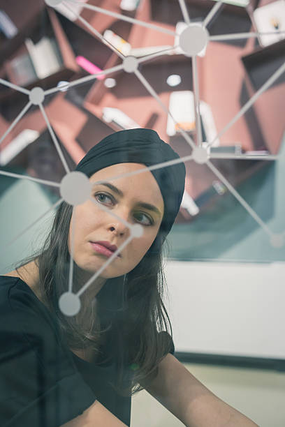 istock Beautiful young brunette posing behind a virtual screen 468154566