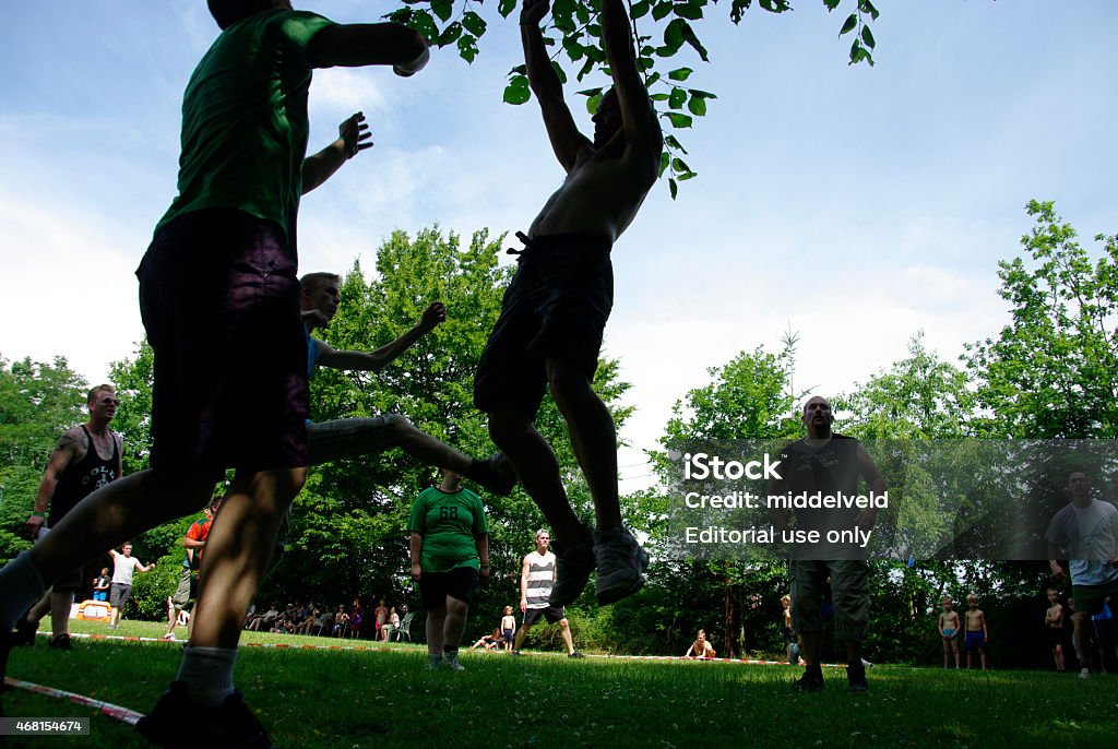 Soccer game of the local youth Schinnen, the Netherlands - June 09, 2014 : Young people having fun with the sports game of the local Church. On this warm day in Spring they enjoying this event in the sunny weather. 2015 Stock Photo