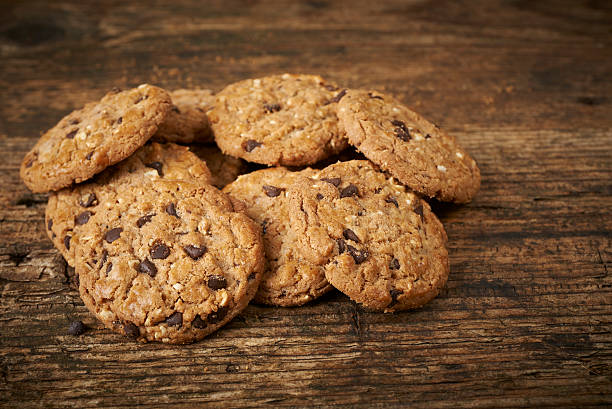 istock chocolate chip cookies on wooden table 468154875