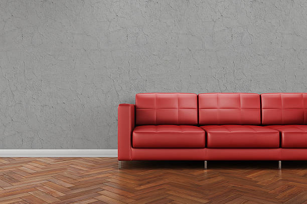 istock Red leather sofa on a wooden tile floor 468156593