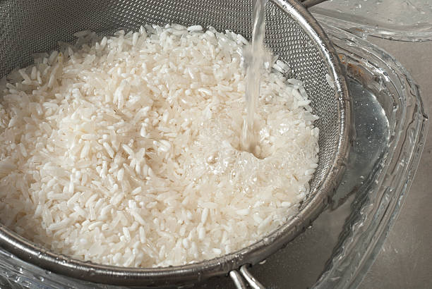istock Washing with fresh water white rice in the sink 468156873