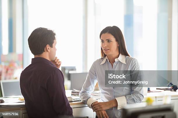 Serious Business People Discussing In Office Stock Photo - Download Image Now - 2015, 30-39 Years, 35-39 Years
