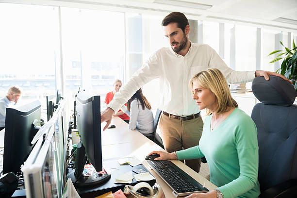 istock Business people discussing over computer in office 468157992