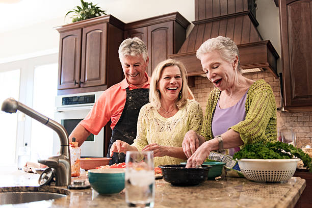 istock Senior people having fun in the kitchen 468158426