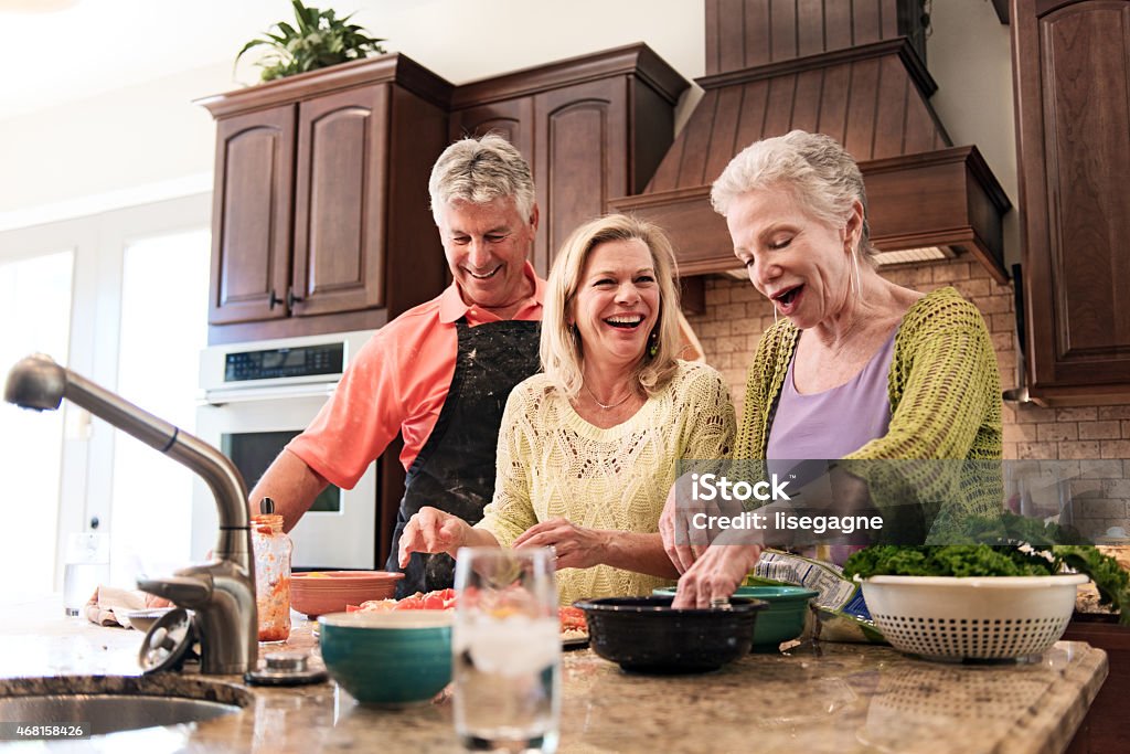 Senior people having fun in the kitchen 2015 Stock Photo