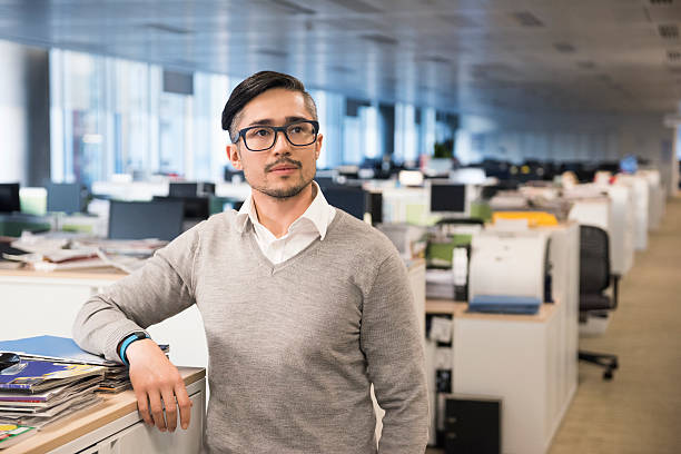istock Thoughtful businessman looking away in office 468158924