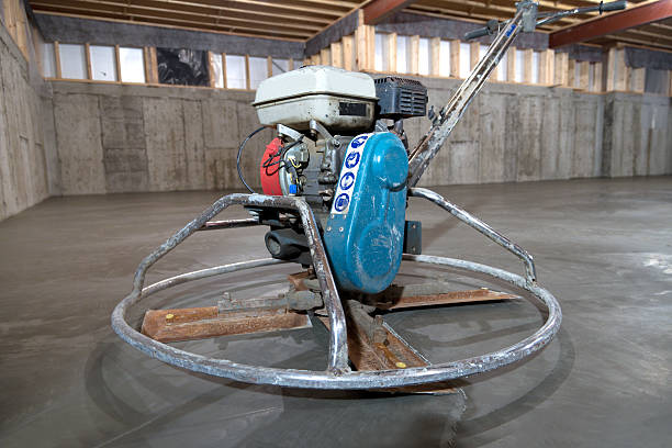 istock Power Trowel on Concrete Basement Floor 468159597