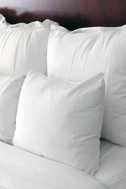 istock Hotel bed pillows with morning light 468160015
