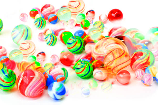 istock Defocused glass marbles in different sizes and colors. 468160519