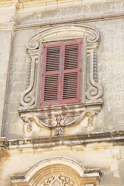 istock Window with shutters and a stone architrave 468161437