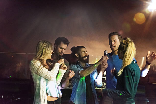 istock Group of friends doing karaoke 468161592