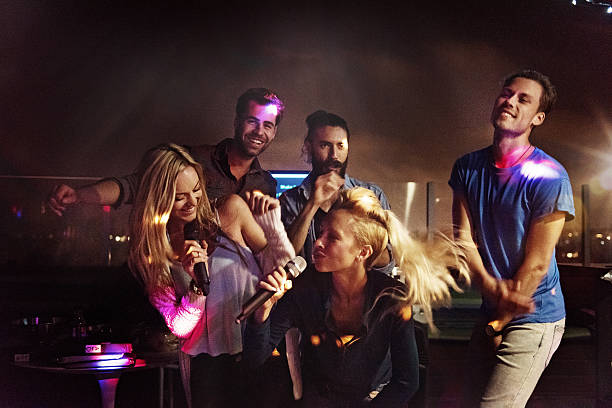 istock Group of friends doing karaoke 468161602